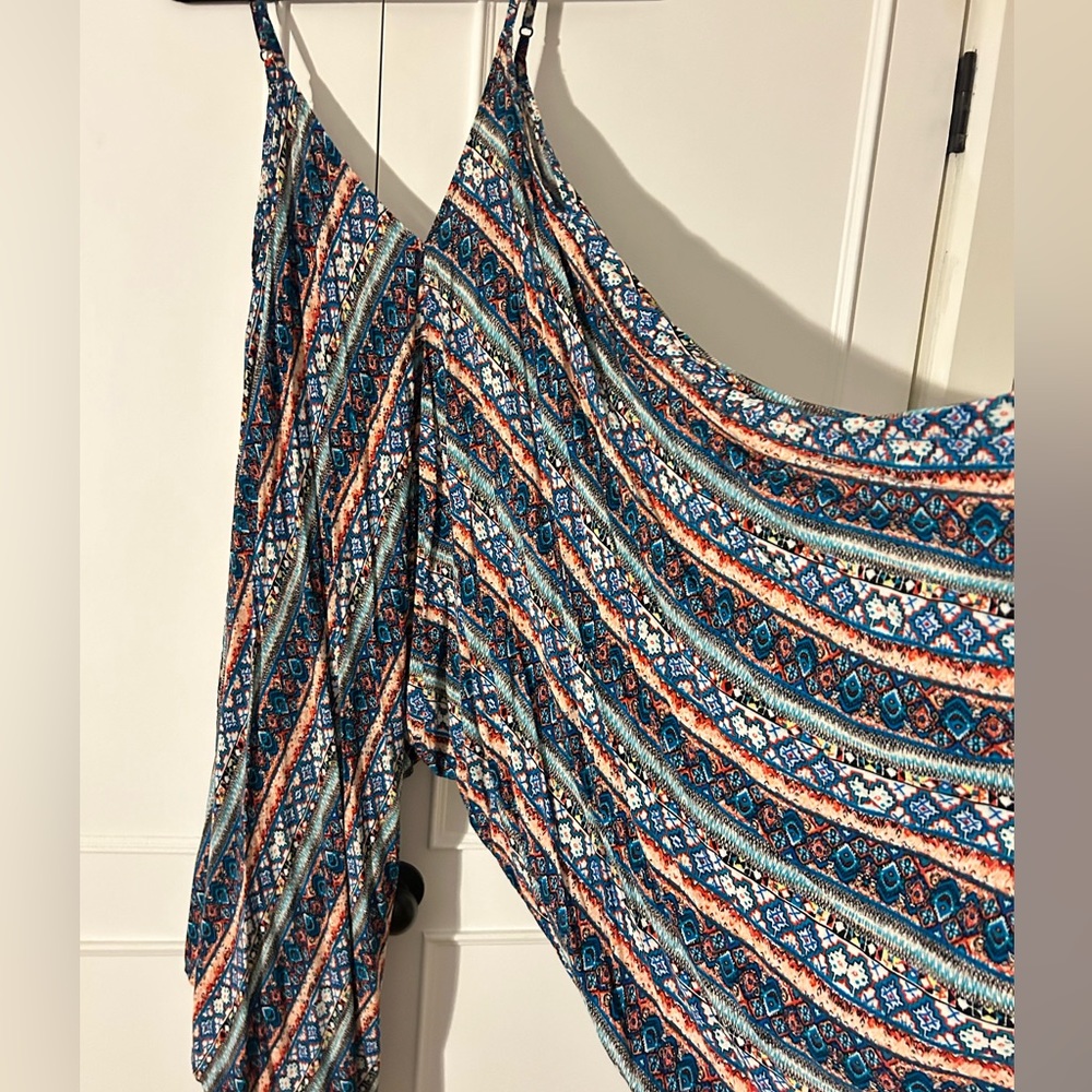 Rosemary brand patterned Jumpsuit with adjustable straps. Fits size Med-XL